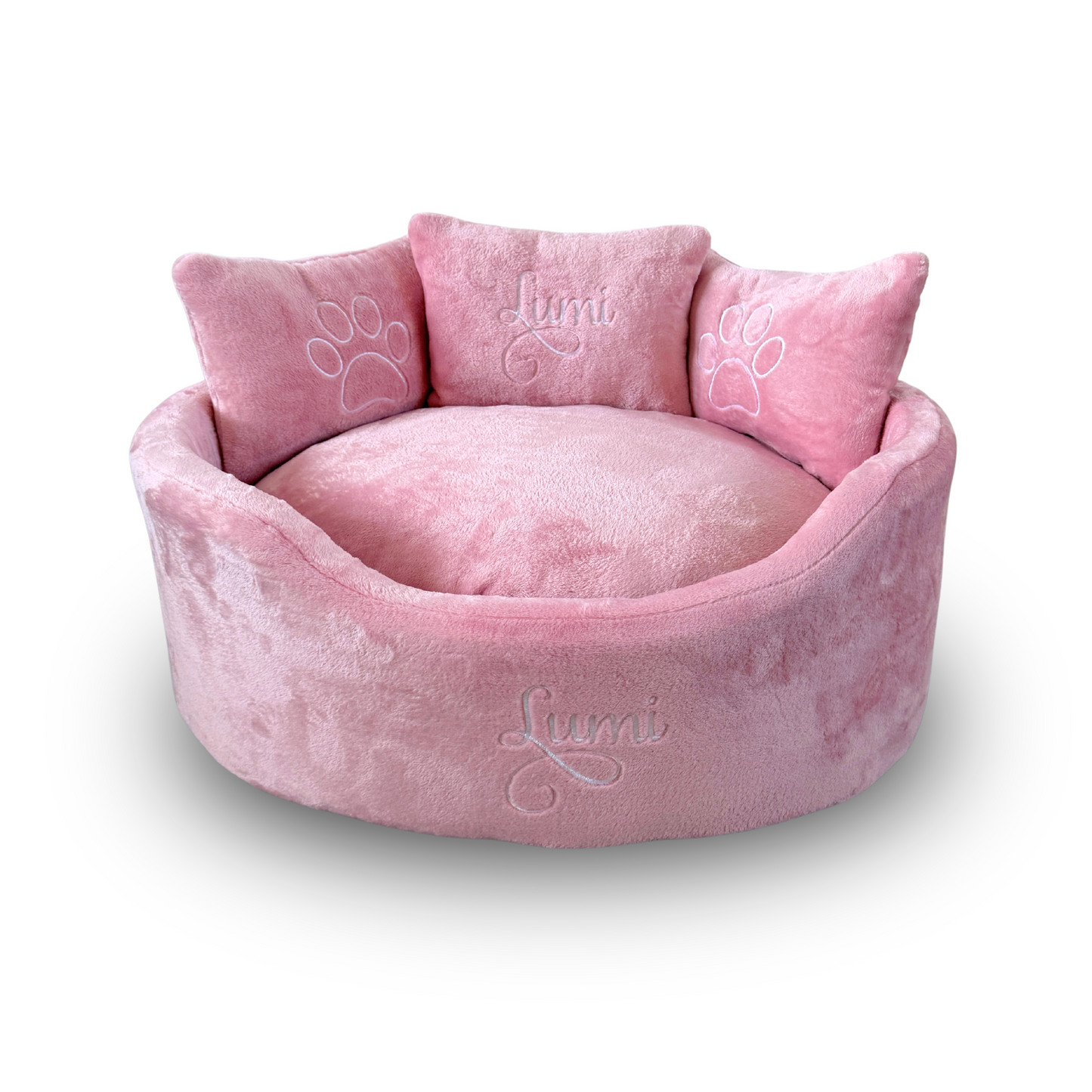 Super soft pink dog and cat bed with personalised name embroidery, providing cozy comfort for pets.