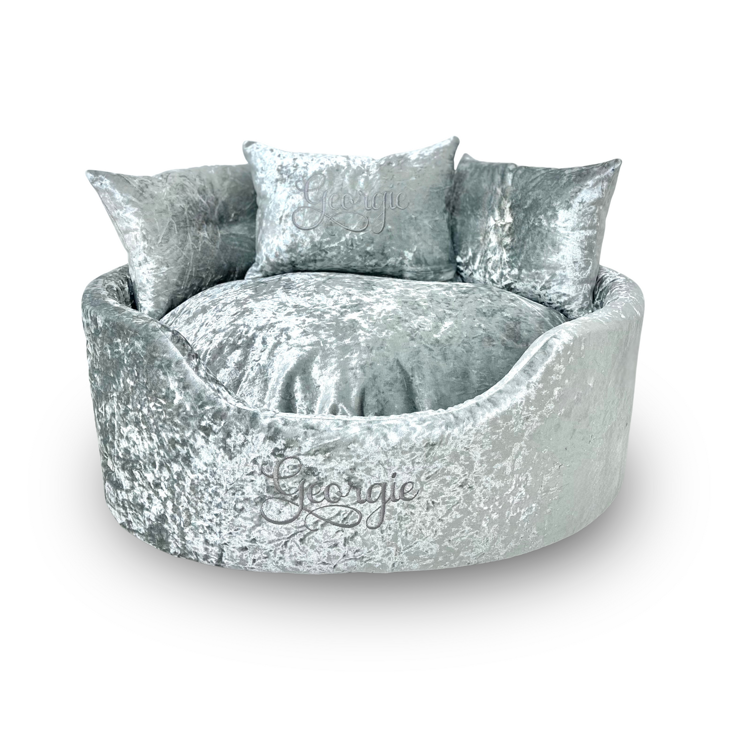 Soft silver crushed velvet dog and cat bed with personalised name embroidery, providing comfort and style for your pet.