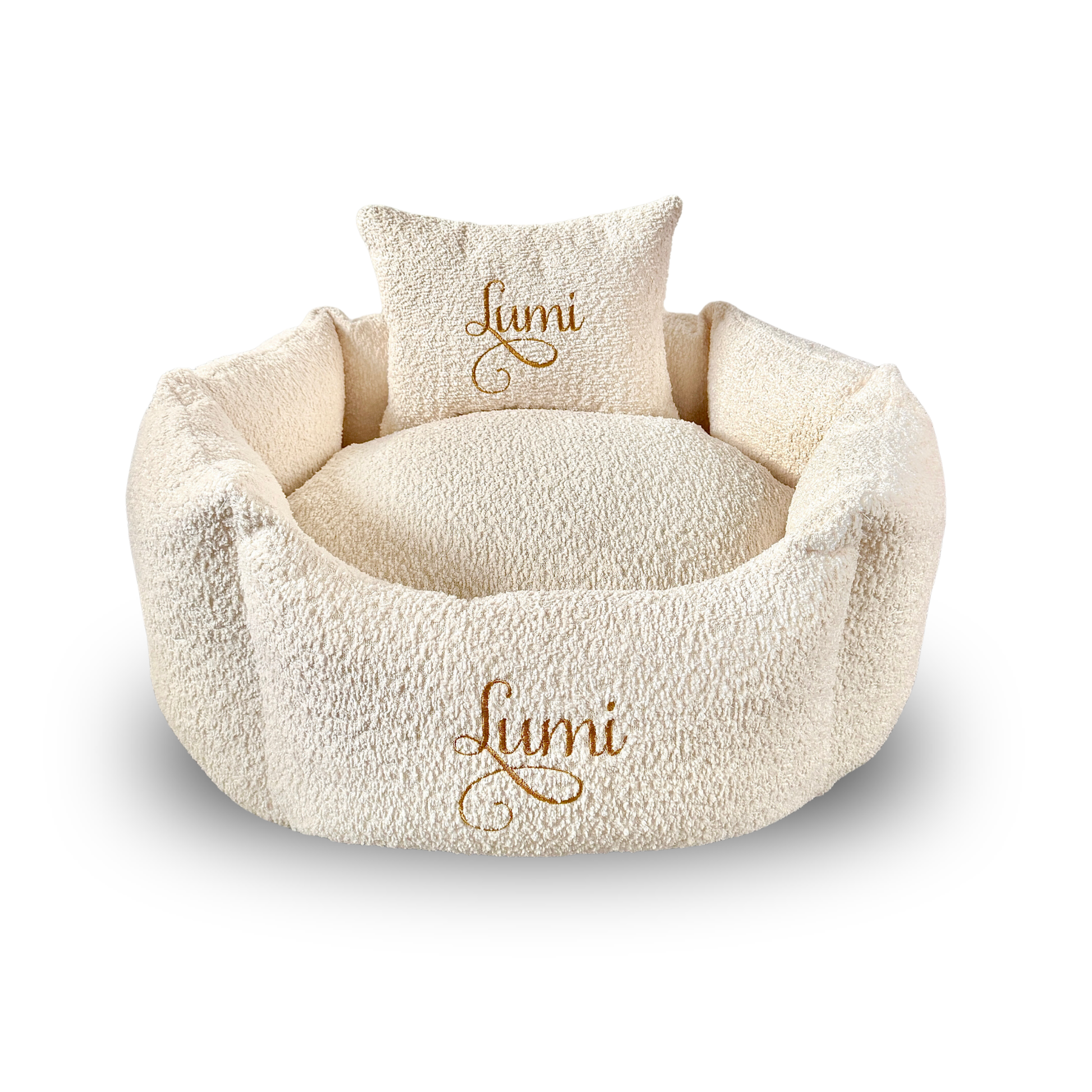 Cream-colored cat and dog bed with a matching pillow featuring the name 