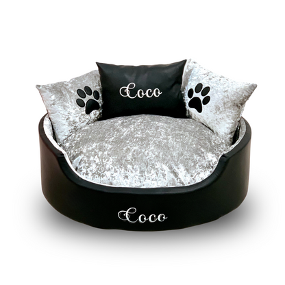 Soft black leather and silver crushed dog and cat bed with personalised name embroidery, providing comfort and style for your pet.