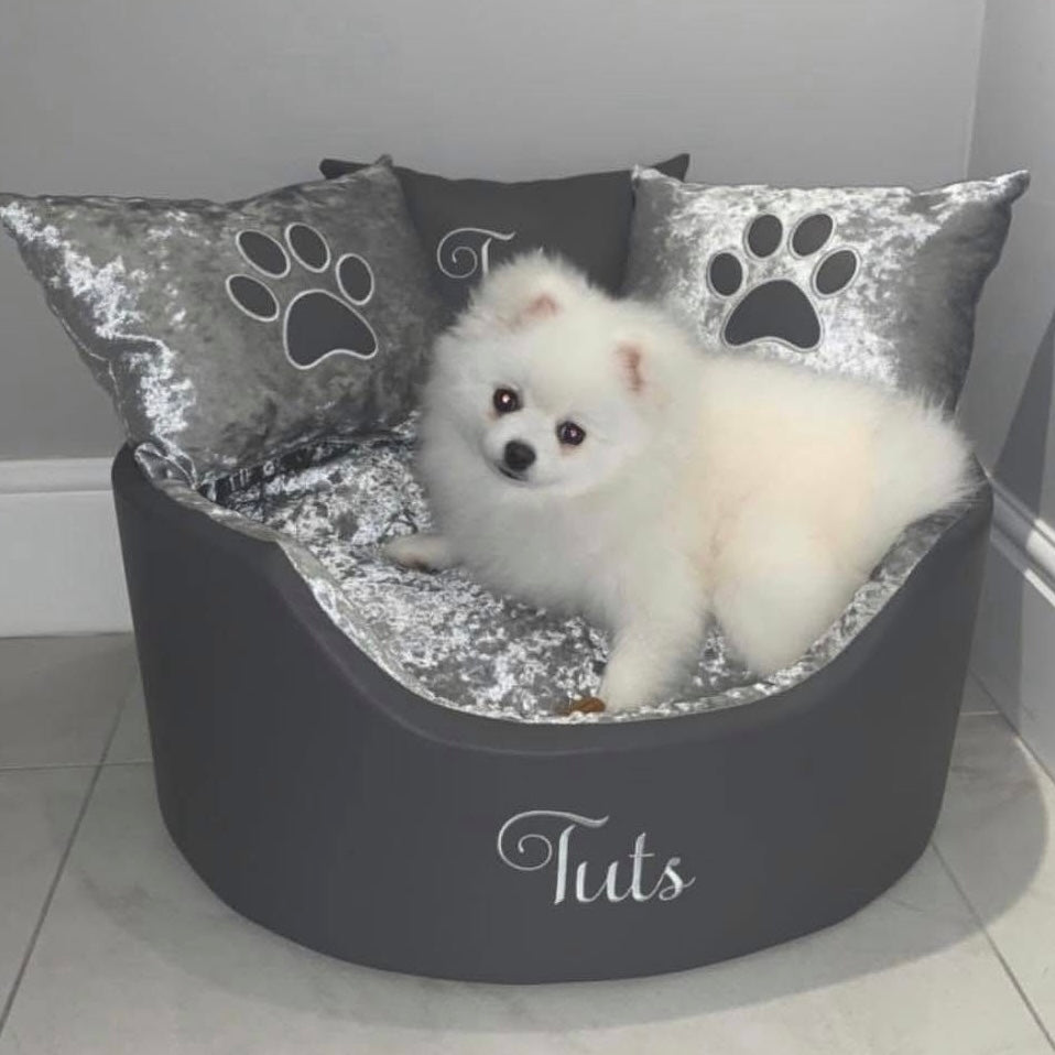 Soft grey leather and crushed velvet dog and cat bed with personalised name embroidery, providing comfort and style for your pet.