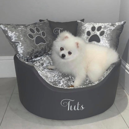 Soft grey leather and crushed velvet dog and cat bed with personalised name embroidery, providing comfort and style for your pet.