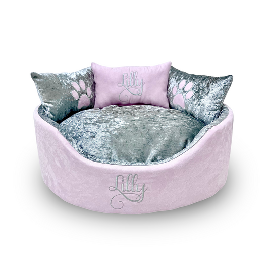 Soft pink suede and silver crushed dog and cat bed with personalised name embroidery, providing comfort and style for your pet.