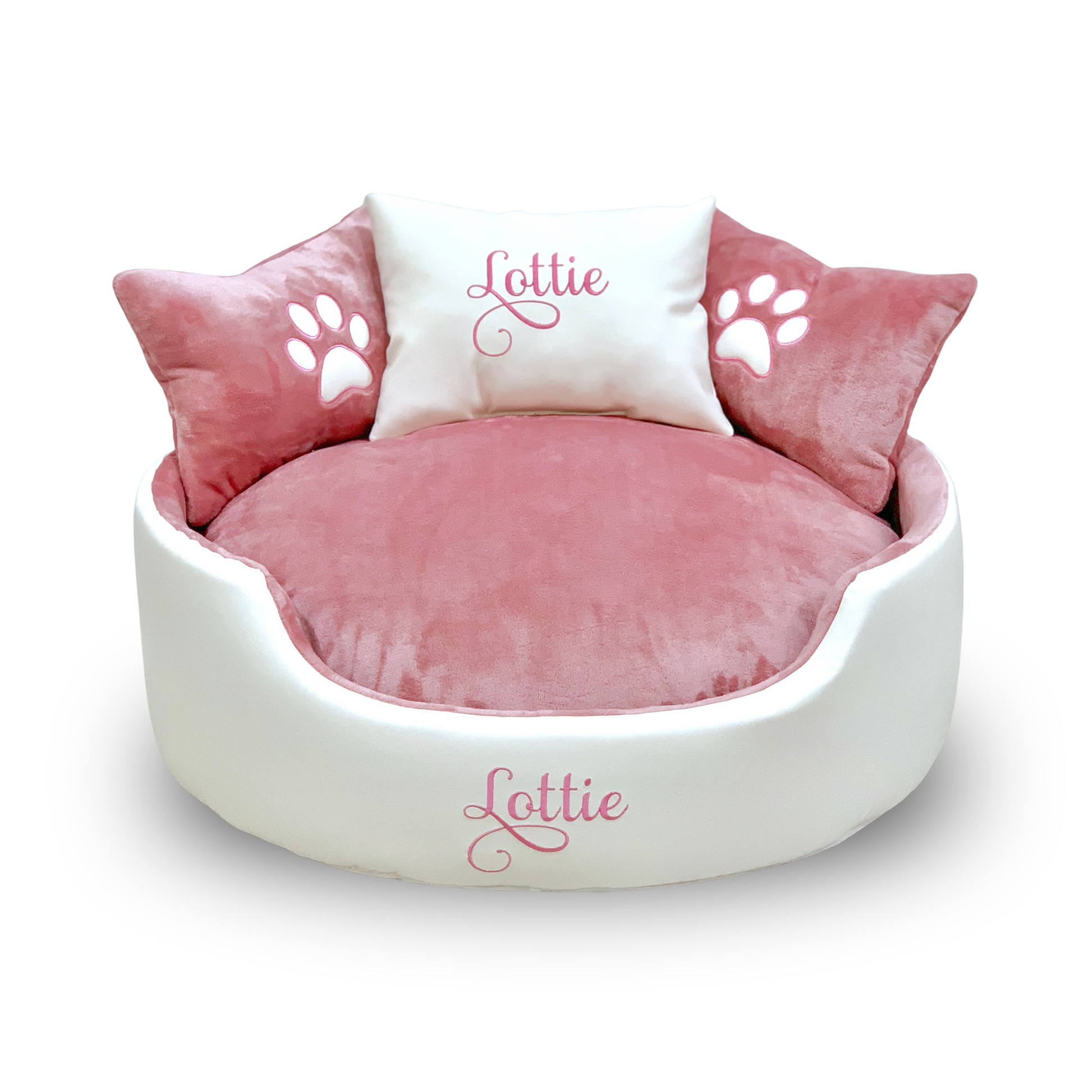 Soft white leather and pink dog and cat bed with personalised name embroidery, providing comfort and style for your pet.